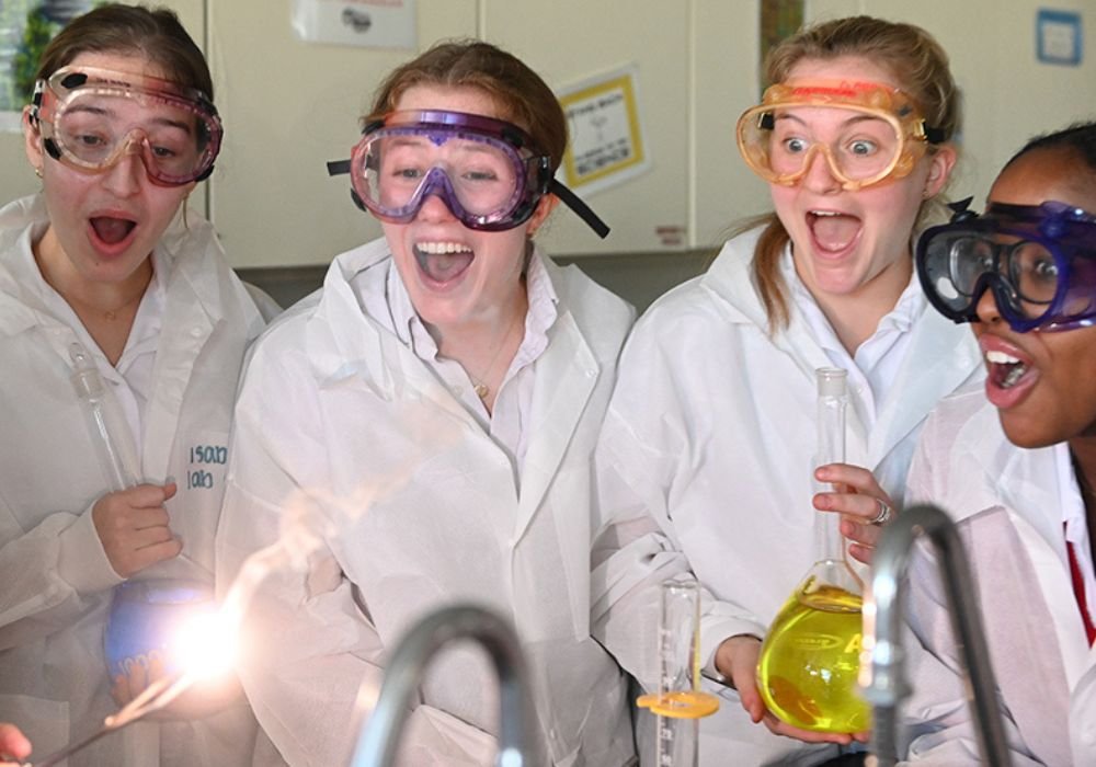 upper school students working in science lab